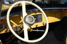 Beautifully restored 1949 Willys Overland Jeepster dash and steering wheel with original horn button