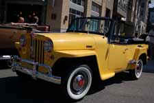 Beautifully restored 1949 Willys Overland Jeepster re-painted in factory correct Fiesta Yellow and Princeton Black colors