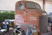 Dodge COE truck in restorable condition at vintage car storage yard