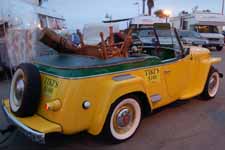 Classic Willys Jeepster has been restored with new Sportsman's Green and Fiesta Yellow paint job