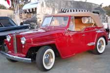 Restored Willys Jeepster Sports Phaeton looks great in factory correct Luzon Red paint job