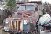 Cool original 1940's Ford farm truck in storage in classic car junk yard