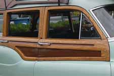 Detailed photo shows original white ash and mahogany wood on the side of a 1951 Buick Estate Wagon woodie