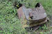 Rusty cowl section from wrecked Ford pickup truck, stored in classic car junkyard