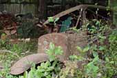 Rough and rusty pickup truck cab section in classic car junkyard