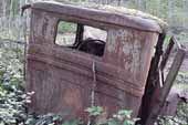 1930's Ford pickup truck cab in classic car wrecking yard