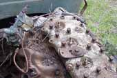 Un-restored Ford flathead V8 engine in classic car junk yard