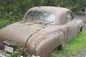 Great looking Dodge project coupe in vintage car junk yard