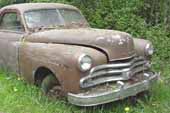 Very clean Dodge project coupe in vintage car junk yard
