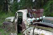 Early Ford pickup truck in vintage car wreckingyard