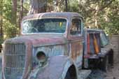 Original Ford flatbed truck in vintage storage lot