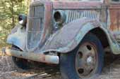 Early Ford flatbed truck in vintage car storage