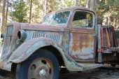 1930's Ford truck at vintage car junkyard needs full restoration