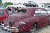 Rare and luxurious Lincoln 4 dor sedan stored at vintage car salvage yard
