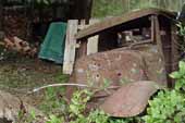 Rough pickup truck cab in vintage car salvage yard