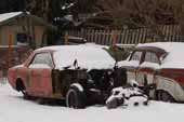 Original 1960's Ford Mustang restoration project parked in snow field