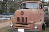 Very unique cab on vintage cab-over truck stored in classic car salvage lot