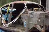 Vintage 1940's 4 door sedan project car stripped for restoration at vintage car salvage lot