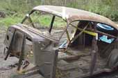 4-door vintage sedan body stripped bare and ready for restoration at classic car wreckingyard 
