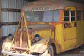 Very cool original 1930's Ford school bus for restoring, parked at vintage car storage lot